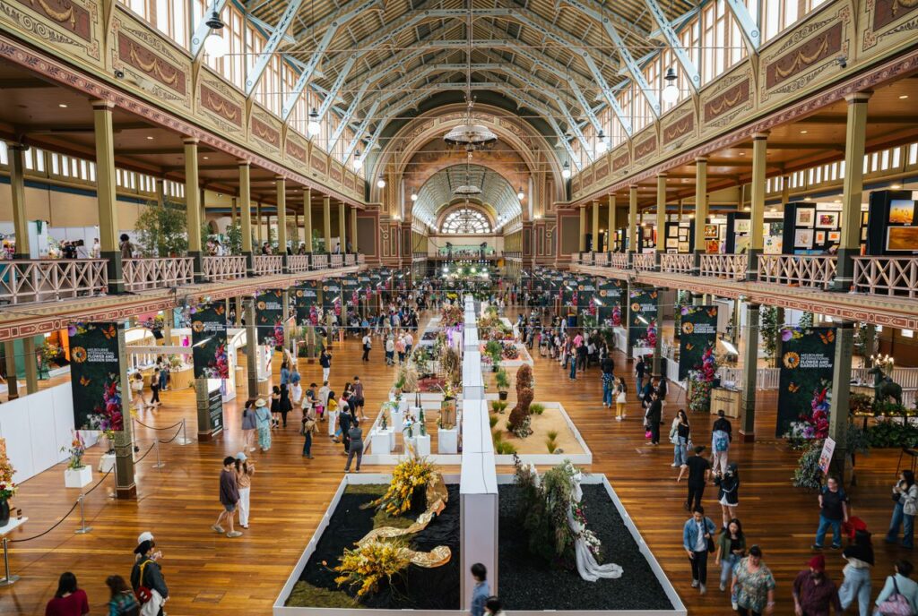 Crafting Captivating Headlines: Your awesome post title goes here Vibrant event at Carlton's Royal Exhibition Building showcasing diverse art and floral displays.